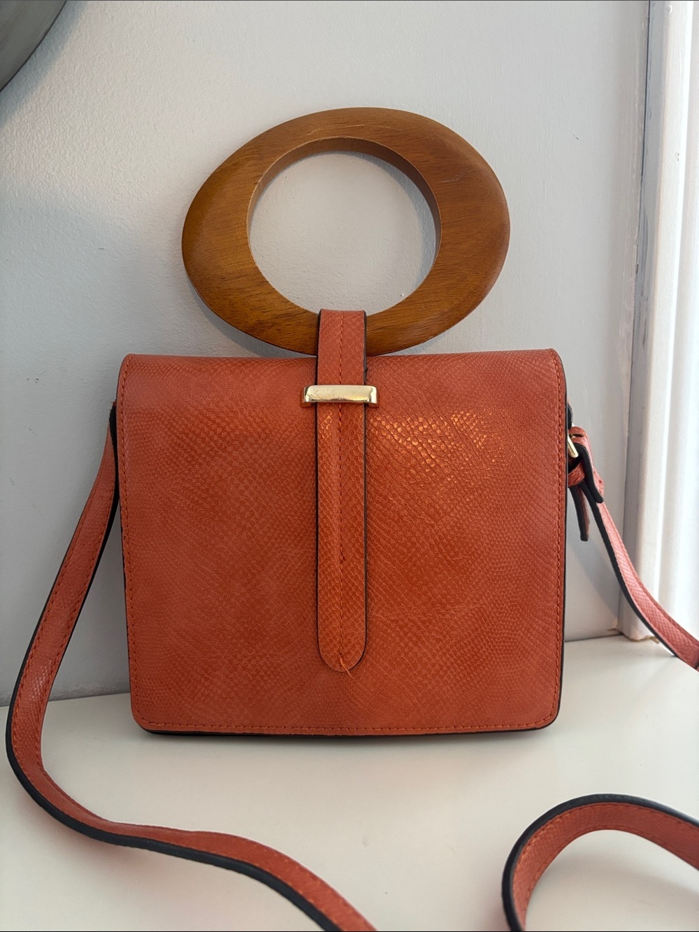 Moda Luxe soft Orange Textured Crossbody Bag with Gold Accent and wood handle